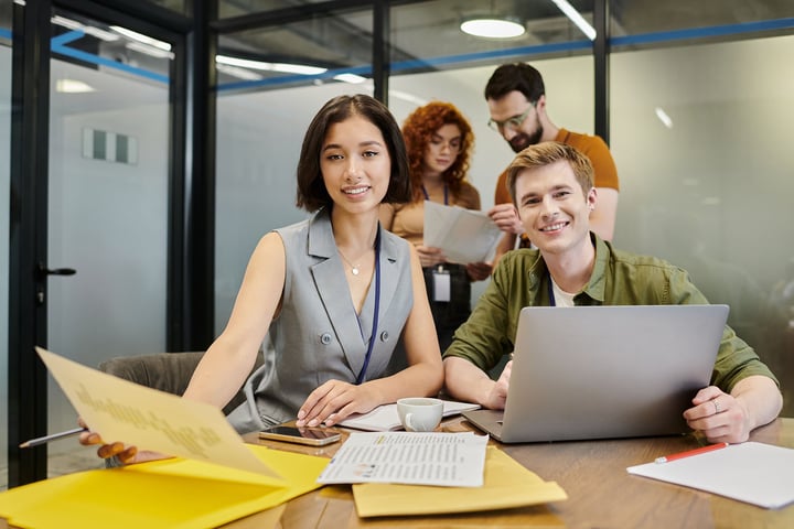 Young Melbourne entrepreneurs collaborating with their accountant in a modern coworking space